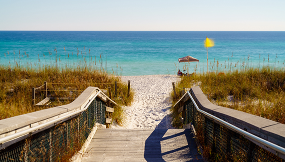 A boardwalk leading to a beach in Northwest Florida A boardwalk leading to a beach in Northwest Florida