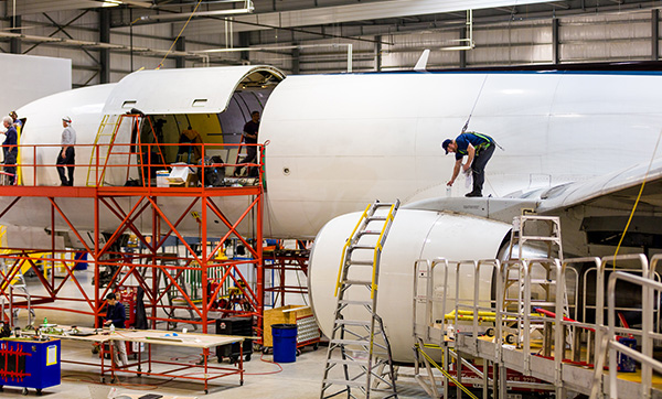 Aviation technicians service a plane in Florida