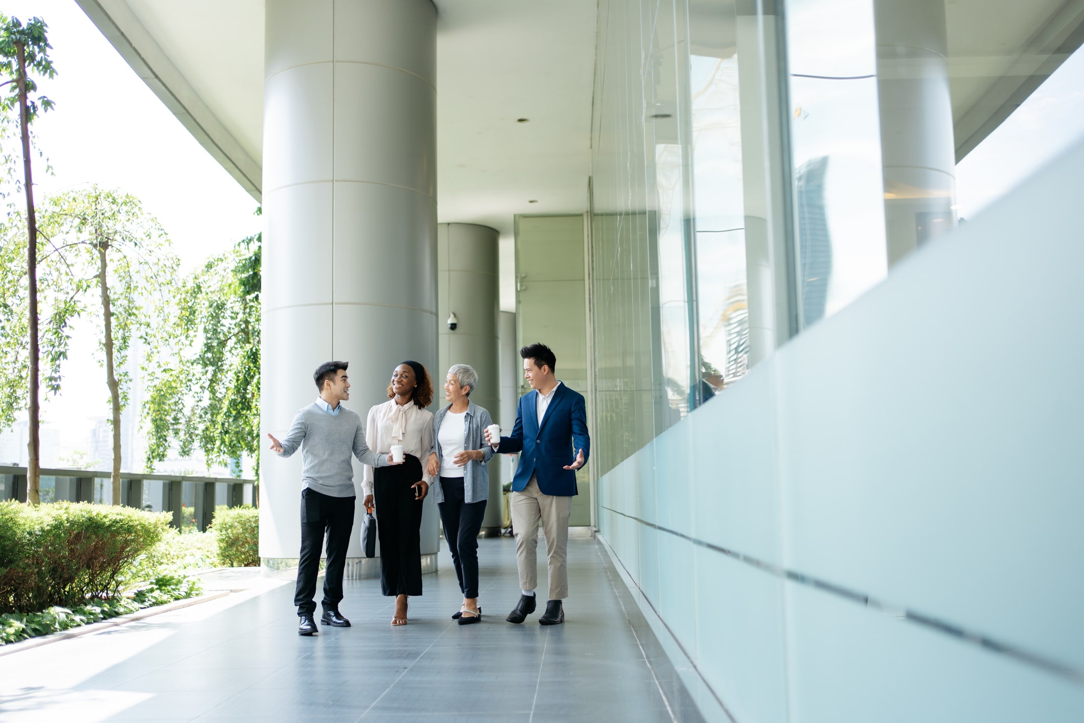 A group of professionals having an outdoor meeting A group of professionals having an outdoor meeting