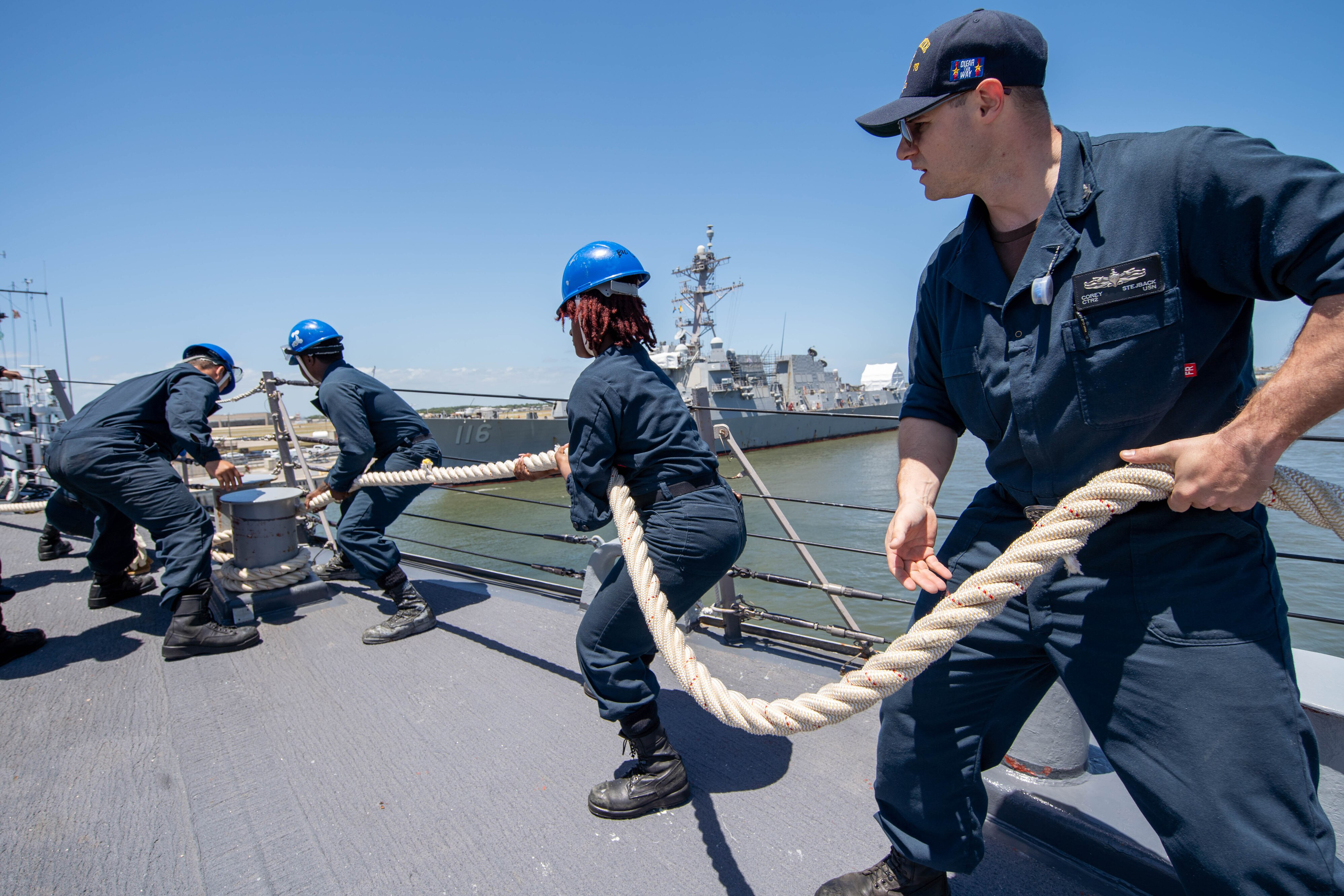 people pulling on rope