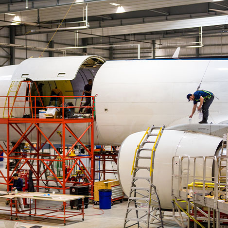 Aviation employees in Florida’s workforce construct an airplane’s outer shell Aviation employees in Florida’s workforce construct an airplane’s outer shell